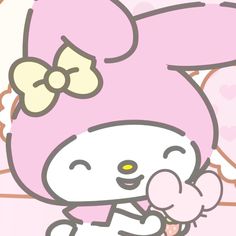 an image of a hello kitty holding something in her hand