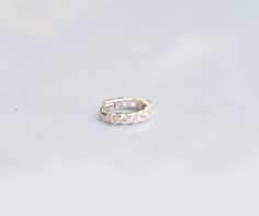 Very Tiny 6mm CZ diamond eternity ring - huggie hoop - Rook - cartilage - helix - lobe earring Listing : single - Material : Sterling silver - 1.5mm Swiss star cut CZ diamond - 18 gauge, 6mm diameter Available color: - Sterling silver - 14 k gold plated - Rose gold plated suitable for Rook/helix/cartilage/lobe/tragus piercing Huggie stye : A hinge is located at the top of the earring that allows the post to open and close without an earring back. For SMALLER diameter supper tiny 5mm available as Silver Cubic Zirconia Huggie Ear Cuff, Cubic Zirconia Huggie Cartilage Earrings For Wedding, Silver Diamond Huggie Cartilage Earrings, White Gold Cubic Zirconia Huggie Cartilage Earrings, Silver Halo Huggie Earrings, Small Hoop Cubic Zirconia Cartilage Earrings For Anniversary, Silver Huggie Piercings With Prong Setting, Diamond Eternity Ring, Tragus Piercing