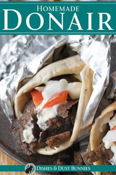 the cover of homemade donuts with meat, cheese and vegetables in foil on a wooden table