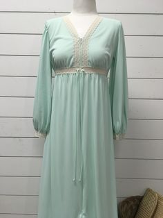 "Vintage Lorraine mint green gown/robe 100% nylon Small Measures 55\" long 17\" underarm to underarm 21\" sleeve Zips partly down Super cute piece Vintage so expected wear Standard age and use wear Good vintage condition See photos for best description" Green Long Sleeve Nightgown For Loungewear, Green Long Sleeve Nightgown For Sleep, Green V-neck Nightgown For Bedtime, Green V-neck Sleepwear, Green Nightgown For Sleepover, Green V-neck Nightgown For Sleep, Fitted Long Sleeve Green Sleepwear, Green Summer Sleepwear For Wedding Night, Green Summer Wedding Night Sleepwear