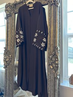 Elegant brown abaya with beautiful floral sleeve embroidery 🤎 Free size fits small medium and large  Legnth 54" Traditional Maxi Abaya With Floral Embroidery, Traditional Long Thobe With Floral Embroidery, Traditional Long Abaya With Floral Embroidery, Elegant Long Sleeve Thobe With Floral Embroidery, Long Abaya With Dabka Work, Modest Long Embroidered Kaftan, Long Embroidered Abaya For Eid, Black Thobe With Floral Embroidery And Long Sleeves, Black Long Sleeve Thobe With Floral Embroidery