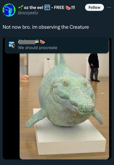 an image of a sculpture that looks like a fish with the caption not now bro im observing the creature we should procreate