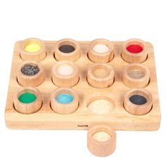 a wooden toy with twelve different colored spices