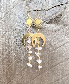 🌙Gorgeous dainty crystal dangle earrings with a little boho witchy twist of moon and/or sun charm. All natural raw chip crystals in unique shape in beautiful colors that will compliment any outfits and turn heads. ☀️Simple, Dainty, Delicate, Elegant and Romantic. The picture does not do its justice the piece is so much prettier in person. Perfect for birthday, Christmas, mother's day, bridesmaid gifts, anniversary, and any holidays. Silver plated Gold plated Sterling Silver 14k Gold filled Draw Celestial Wire Wrapped Dangle Earrings, Spiritual Dangle Moonstone Jewelry, Mystical Crystal Drop Earrings As Gift, Dangle Crystal Earrings With Moon Charm For Gifts, Wire-wrapped Moonstone Dangle Earrings, Gold Dangle Crystal Earrings With Moon Charm, Moonstone Crystal Dangle Earrings, Moonstone Moon Charm Drop Earrings, Gold Moonstone Dangle Crystal Earrings