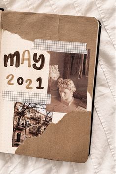 an open book with pictures and words on the cover that says may 2021 in brown paper