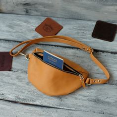 This Fanny Pack is perfect for carrying around the essentials at festivals, concerts, hikes, or just being on the go! With it's one of a kind design that has been hand-crafted from start to finish, the quality of our workmanship is reflected in our product. A great gift for that someone special in your life or as a gift to yourself! Adjustable shoulder strap. Size: - Length -- 9.8 inches |25 cm| - Height -- 5.7 inches |14.5 cm| - Maximum strap length -- 37.5 inches | 95 cm| -- Material: 100% gen Large Capacity Leather Belt Bag For Travel, Zipper Pouch Belt Bag, On-the-go Belt Bag With Zipper Pouch, Travel Crossbody Belt Bag With Zipper Pocket, Trendy Pouch Chest Bag For Travel, Large Capacity Pouch Belt Bag For Daily Use, Travel Belt Bag With Zipper Pouch, Trendy Travel Pouch Chest Bag, Travel Belt Bag With Adjustable Strap