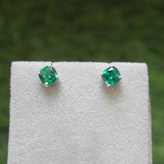 * Material: 925 Sterling Silver * DETAILS ✥ Handmade Studs ✥ - Center Stone: Lab Emerald - Center Stone Size: 6 MM - Center Stone Shape: Cushion  ✥ O T H E R ∙ I N F O R M A T I ON ✥ ♦ Your item will be nicely packed to gift in elegant jewelry boxes. ♦ Custom Order We can make custom rings in almost any shape and style. If you want a specific model, please send us a clear picture and we will do our best. ♦ Delivery All Item will be Shipped within 3 to 5 Days after payment receive. The delivery t Green Emerald Earrings, Emerald Stud Earrings, Emerald Green Earrings, Emerald Earrings Studs, May Birthstone, Earrings Simple, Birthstone Gifts, Emerald Earrings, Green Emerald