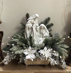 an arrangement of christmas decorations on a mantle