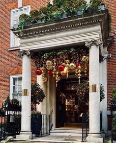 an entrance to a building decorated for christmas