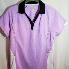 This Is A Brand New, With Tags Women's Izod Size Extra-Small (Xs) Polo Shirt. This One Button V-Neck Polo Is Light Purple In Color With A Black Collar And White Panels On The Sides. Shirt Is Composed Of 100% Polyester And Is Super-Lightweight. This Izod Product Has An Msrp Of $68 And Is Excellent For Golf Or Casual Wear. Sporty Fitted Purple T-shirt, Polo Shirt Colors, White Paneling, Golf Polo Shirts, Shirt Button, Golf Polo, Light Purple, New Woman, Purple And Black