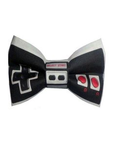 a black and white bow tie with two red buttons on the front, and an arrow in the middle