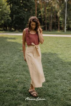 Wrap Linen Skirt: A boho style and minimal aesthetics. This skirt, adorned with a charming bow, is your ticket to effortless elegance. It's the go-to choice for fall looks for women, whether you're embracing casual chic or seeking the perfect party look. Perfect for work or a casual evening out outfit. IRIS is not just a trendy fall outfit; it's the ideal choice for fall weddings, date nights. Add this piece to your capsule wardrobe and enjoy free shipping on orders over $100! Chic Asymmetrical Wrap Skirt For Brunch, Elegant Relaxed Wrap Skirt, Elegant Wrap Skirt With Relaxed Fit, Spring Wrap Skirt With Tie Waist, Chic Wrap Skirt For Spring, Chic Lined Wrap Skirt, Chic Wrap Skirt With Lined Detail, Summer Wrap Skirt For Brunch, Lined, Chic Wrap Skirt With Lining