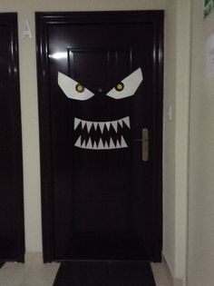 the door is decorated with an evil face