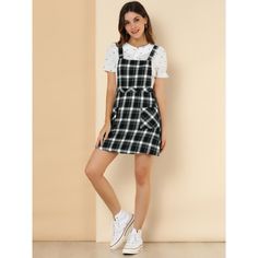 Add a versatile layer to your new-season wardrobe with this suspender dress. It features a simple and classic design with a mini length and an A-line silhouette. The front button and button decor underscore the casual cool of these plaid-printed overalls. It is great for being paired with a solid color top and bag for an everyday look! Perfect to match it with blouses. Casual Spring Suspender Dress For Work, Casual Dresses With Adjustable Straps For Work, Casual Work Dresses With Adjustable Straps, Casual Workwear Dress With Adjustable Straps, Casual A-line Fitted Pinafore Dress, Casual A-line Mini Dress With Adjustable Straps, Casual Fitted Knee-length Pinafore Dress, Casual Knee-length Fitted Pinafore Dress, Casual Mini Pinafore Dress For Spring