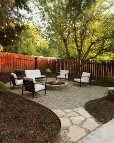 an image of a patio with chairs and fire pit in the back yard, on instagram