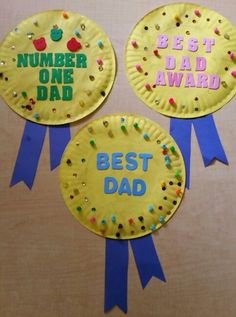 three paper plates with the words best dad and number one award on them