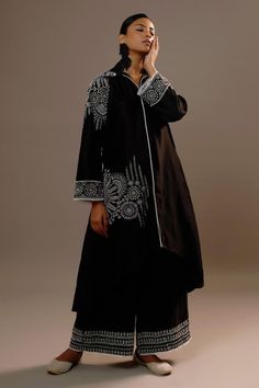 Black full sleeves long kurta in summer silk base with mughal bloom embroidery and collared neckline. Paired with matching flared palazzo.
Components: 2
Pattern: Embroidery
Type Of Work: Floral Bloom
Neckline: Collar
Sleeve Type: Full
Fabric: Summer Silk
Color: Black
Other Details: 
Attached inner lining
Length:
Kurta: 35inches(front), 46inches(back)
Palazzo: 38inches
Occasion: Sangeet, Mehendi and Haldi - Aza Fashions Bloom Embroidery, Palazzo Kurta, Kurta With Palazzo, Flared Palazzo, Long Kurta, Embroidery Floral, Pattern Embroidery, Silk Embroidery, Indian Ethnic Wear