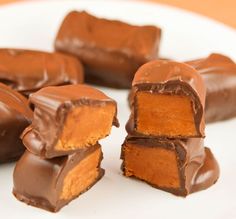 several pieces of chocolate covered candy on a plate