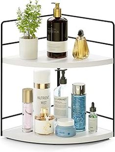 three tiered shelf with bottles and cosmetics on it