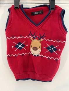 "Christmas Sweaters Festive Attire Holiday Sweater Ugly Christmas Sweater Party Kids Reindeer Knit Sweater Vest Child Christmas Sweater Vest Festive Attire Holiday 6/9 Mod. Ugly Christmas Party Retro Vintage Hipster, v-neck, sleeveless.  100% Cotton Perfect Top for the Holiday Season!  Visit the Shop for More Festive Holiday Attire!  Measurements/Size:    Size:  6-9 mos.   Length from shoulder to hem:  12\"   Chest:  22\" Condition: Good Condition, no snags, smoke and pet free home, machine wash Red Knitted Top For Christmas, Red Knit Christmas Top, Knitted Tops For Christmas Holiday, Red Knit Top For Christmas, Festive Attire, Christmas Vest, Christmas Sweater Vest, Vintage Hipster, Kids Jumpers