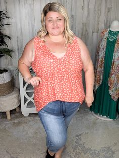 Looking for a tank that’s easy to wear and looks fabulous all year round? This dark coral tank features an ivory floral print with pops of marigold, making it a perfect piece for any season. The buttery soft material is lightweight and stretchy, giving you all-day comfort. With a flattering V-neck and full coverage back, you can wear your favorite bra without any fuss. The ruffle detail around the neckline adds a touch of feminine flair, and it’s sewn down in the center, so it stays perfectly in Fitted Rayon Tank Top For Spring, Spring Casual Rayon Tank Top, Casual Rayon Tank Top For Spring, Spring Orange V-neck Tank Top, Orange V-neck Tank Top For Spring, Spring Floral Print Stretch Tank Top, Spring Rayon Tank Top For Day Out, Spring Sleeveless Rayon Tank Top, Spring Stretch Orange Tank Top