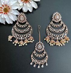 This Set comes with Maangtikka and matching earrings and in 3 beautiful pastel colors. Extremely high quality stones and handwork for a beautiful elegant look. This lightweight and elegant Maangtikka set is perfect for any bridesmaid, bride, sangeet or any occasion or event as a gift for any occasion as any one who loves jewelry will love this statement piece. It has beautiful colors that really make the set a statement piece. Product Details: • Tikka/Headpiece • Earrings Free Shipping/Ready to Luxury Multicolor Festive Jhumkas, Luxury Meenakari Tikka For Festive Season, Rose Gold Chandbali Jewelry For Wedding, Rose Gold Chandbali Wedding Jewelry, Elegant Rose Gold Chandbali Jewelry, Elegant Chandbali Sets With Matching Earrings, Elegant Rose Gold Earrings For Festive Occasions, Elegant Rose Gold Festive Earrings, Elegant Festive Rose Gold Earrings