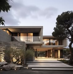 an exterior view of a modern house at dusk