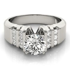 a white gold ring with diamonds on the sides and a center stone in the middle