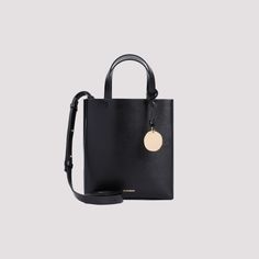 The Jil Sander black calf leather Bond mini tote bag combines modern design with functionality. Its structured silhouette, top handles, and adjustable shoulder strap offer versatile carrying options. Finished with gold-tone accents and a metallic logo, this bag is perfect for chic outings.

- One main compartment  
- Material: 100% calf leather  
- Gold-tone hardware details  

- Dimensions: W:17cm  H:19cm D:6,5cm Jil Sander Bag, Black Leather Tote, Mini Tote Bag, Leather Cap, How To Make Handbags, Mini Tote, Black Tote Bag, Jil Sander, Handbag Backpack