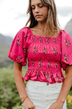 THIS SALE ITEM IS FINAL SALE The Roxy Top-Hot Pink is an ultra-feminine pick for any occasion. Its paisley pattern, smocked bodice, puff sleeves, and peplum style add a flirty touch to the timeless square neckline. Whether you choose to dress it up or down, the Roxy Top guarantees you'll stand out from the crowd! *Cropped; smocked bust* Material Content: 100% Polyester Material Pattern: Paisley Montana is 5’8” wearing a small Model Measurements: Montana Height: 5'8" // Chest: 33" // Waist: 25.5" Fitted Pink Tops With Smocked Back, Feminine Smocked Top With Lantern Sleeves, Fitted Smocked Top With Puff Sleeves For Brunch, Pink Smocked Top For Fall, Fitted Pink Top With Smocked Back, Feminine Fitted Smocked Top With Puff Sleeves, Fitted Smocked Top With Floral Print For Brunch, Fall Smocked Top With Short Sleeves, Fitted Puff Sleeve Smocked Top For Brunch