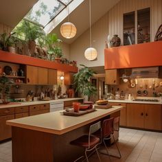 a kitchen filled with lots of wooden cabinets and counter top space under a skylight