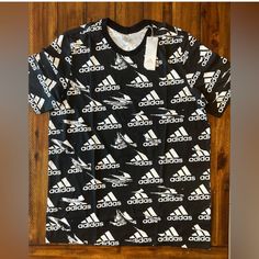 Mens Size Xlt New With Tags Sporty Black Printed T-shirt, Black Printed Sporty Top, Black Sporty Printed T-shirt, Adidas Graphic Tee Cotton T-shirt, Adidas Short Sleeve T-shirt With Graphic Print, Adidas Graphic Tee With Logo Print, Adidas Graphic Print Short Sleeve T-shirt, Casual Black Printed T-shirt, Adidas Black T-shirt With Letter Print