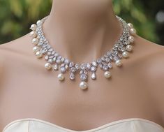 "If you love Hollywood glamour, here's the wedding jewelry you've been searching for. The sparkling, crystal and pearl design of the 'Juliette' necklace features marquise and round shaped crystals in an eye-catching statement style. With Swarovski pearls dotted throughout the necklace, it will take your breath away. ❣ If you would prefer an all crystal necklace please select from pearl color menu. ❣ Available in rose gold, silver (rhodium) and gold. ❣ Necklace measures 17\" ❣ Nickel-free and non Statement Wedding Jewelry, Crystal Wedding Necklace, Bridal Pearl Necklace, Pearl Statement Necklace, Wedding Bridal Jewellery, Necklace Crystal, Wedding Jewellery Necklace, Crystal Wedding, Swarovski Pearls