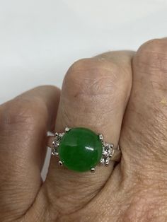 Vintage green nephrite jade Ornate German Silver ring, does not tarnish, NOT sterling Sizes 7, 8 or 9 All rings are shipped in a nice gift box. Check out our over a THOUSAND great reviews Engraving is $4 per letter and is not always perfect depending on the piece. It can take a few days if the jeweler is busy. This is payable to Paypal Judithsltd@gmail.com Green Cabochon Round Stone Rings, Green Emerald Crystal Ring, Classic Green Jade Jewelry, Green Jade Round Stone Jewelry, Green Jade Jewelry With Round Stone, Green Crystal Round Ring As Gift, Green Crystal Gemstone Ring, Green Crystal Round Ring Gift, Green Gemstone Crystal Ring