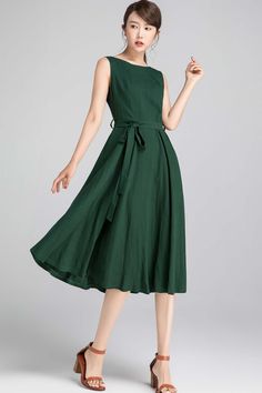 "This Vintage swing dress features a fit and flare silhouette , pleated neckline . A must have lady midi dress, wearing this vintage inspired dress is a fashionable chance worth taking. DETAILS * 50% linen , 50% cotton * Cotton lining on upper part * Seam pockets * Boat neckline * Back zip closure * Sleeveless dress * Fit and flare dress * Below Knee Length * Summer, Spring * Wash by hand or machine with cold water, Ironing after dry SIZE GUIDE Size vary between Brand and Country Please get your Green A-line Midi Dress, Summer A-line Sleeveless Dress With Pleated Waist, Spring Midi Dress With Box Pleat And Full Skirt, Spring Tea-length Dress With Box Pleat, Summer A-line Midi Dress With Pleated Waist, Spring Sleeveless Dress With Box Pleat, Retro Solid Color Midi Dress, Summer Vintage A-line Pleated Dress, Summer A-line Dress With Box Pleat