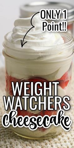 a jar filled with whipped cream and strawberries