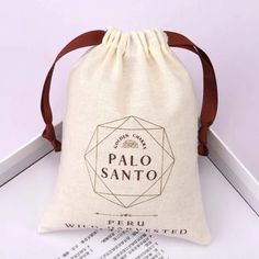 a bag with the word palo sano printed on it sitting on top of a table