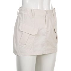 A cargo skirt is an item of women's casual clothing. It's a variation of the cargo pants and shorts style inspired by the military field wear that became a fashion trend in the 1990s. Our Ruth Y2k Cargo Skirt is great for an overall casual look, so pair them with your favorite denim jacket & a pair of sneakers! Product Description Material: Polyester, Spandex Dresses Length: Above Knee, Mini Kindly refer to the size chart below (in cms), before placing your order for the best fit: SIZE WAIST BUS Y2k Style Khaki Bottoms For Spring, Spring Y2k Khaki Bottoms, Utility Cotton Cargo Skirt, Utility High Waist Mini Skirt With Pockets, Utility Style Cotton Mini Cargo Skirt, Utility Style Cotton Cargo Mini Skirt, Trendy Cotton Skirt With Multiple Pockets, Y2k Style Summer Cargo Bottoms, Spring Cotton Cargo Skirt With Multiple Pockets