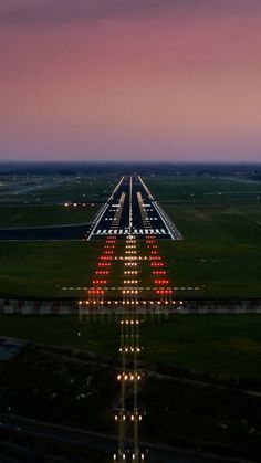 an aerial view of the runway at dusk