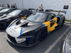 several different colored sports cars parked next to each other