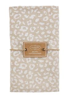 a notebook with a brown and white leopard print on it