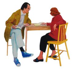 two people sitting at a table and one is reading a book while the other sits on a chair