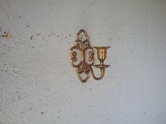 This charming handmade wall mounted brass Swedish candle holder dates back to the 1940s. It will be an original wall decoration in virtually any room. The candlestick was not polished and had a beautiful old patina. It shows the passage of time, minor scratches and abrasions. Please look carefully at the photos as they are part of the description. All items I sell are used/vintage/vintage so please check the photos before purchasing as they form part of the description. If you are interested in Swedish Candle, Wall Candle Holder, Original Wall Decor, Wall Candle, Scandinavian Wall, Wall Candle Holders, Brass Candle Holders, Brass Candle, Wall Candles