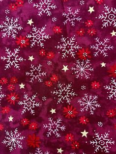 red and white snowflakes on purple fabric with silver stars in the center,