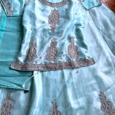 Great For A Teenager! Satin Like Base With Net Outer Layer. Silver Sequin, Bead And Thread Work. Light Blue Lengha, Blue Lengha, Thread Work, Silver Sequin, Blue And Silver, Sequin, Color Blue, Light Blue, Thread