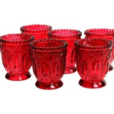 a set of six red glass cups sitting next to each other