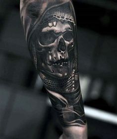 a man with a skull tattoo on his arm