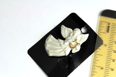 "Vintage Lenox porcelain Pin Brooche 24k Gold Trim Angel . Made of beautiful classic LENOX cream color china porcelain. Angel pin is approx. 1 1/2 \" ( 3.8 cm) by 1 1/2 ( 3.8 cm). Pin is approx. 2\" ( 5 cm) by 1 1/4\" ( 3 cm) . The clasp is in good working order. Perfect vintage condition, mint. Perfect gift ! Thank you for looking!" Elegant White Enamel Pin For Gift, Classic White Brooches As Gift, Classic White Brooches For Gift, Classic White Brooches For Gifts, Porcelain Angel, Angel Pin, Ocean Shores, China Porcelain, White Porcelain