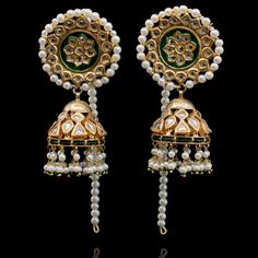 Blend of craftsmanship and intricate layout, making this set a classic must have.This look includes a pair of beautiful jhumkey earrings with pearl ear chain and a teekah. Approximate earrings length is 3.6".Gold-plated on high-quality brass as base metal. In-stock & ready-to-ship. *Please Note: We use faux stones and beads in all of our jewelry. Elegant Brass Jhumkas For Rituals, Ceremonial Chandbali Brass Jhumkas, Elegant Meenakari Earrings For Rituals, Elegant Chandbalis With Latkans For Rituals, Elegant Brass Tilla Danglers, Elegant Brass Danglers With Tilla, Elegant Kundan Earrings For Rituals, Ceremonial Brass Jhumkas With Latkans, Elegant Chandbali Danglers For Rituals