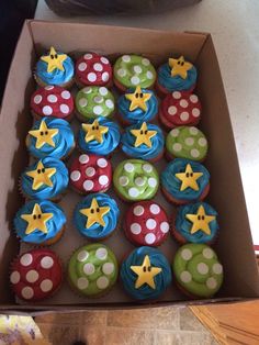 a box filled with lots of cupcakes on top of a counter